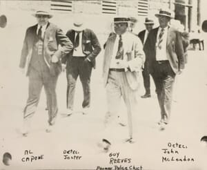 Al Capone walking along Dade County Courthouse in 1930
