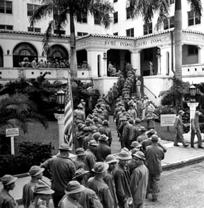 Soldiers Standing in Line for Mess Hall at Hotel Evans in 1942